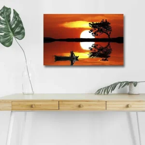 Rabatter Canvastavla med LED-belysning - Solnedgång över en spegelblanka sjö med en ensam båt och en silhouett av ett träd Orange / Svart / Gult - Inredning