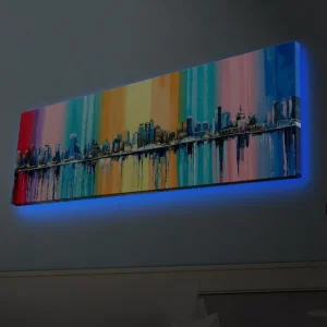 Canvastavla med LED-belysning - Färgglad stadsbild med horisontlinje och reflektioner i vatten Blå / Rosa / Orange - Inredning Beställ nu