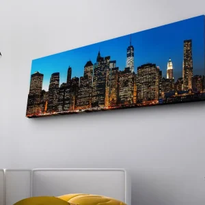 Canvastavla med LED-belysning - Stadssilhuett av New York i skymning Blå / Svart / Guld - Inredning Köp nu