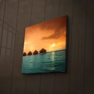 Sista chansen Canvastavla med LED-belysning 28x28 cm - Solnedgång över stilla hav med övervattenshus Orange / Turkos - Inredning